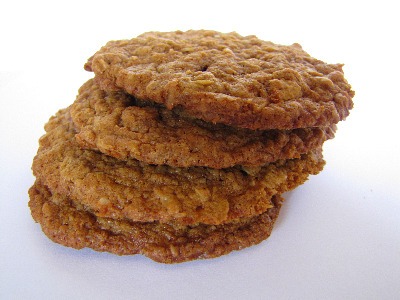 Image of four Kamut Oatmeal Cookies stacked on top of each other on a white background.