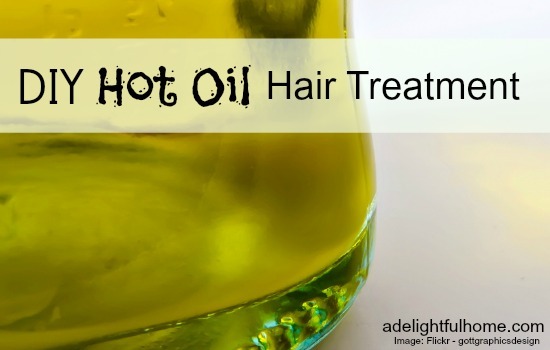 Close up image of oil in a glass bottle. Text overlay says, "DIY Hot Oil Hair Treatment".