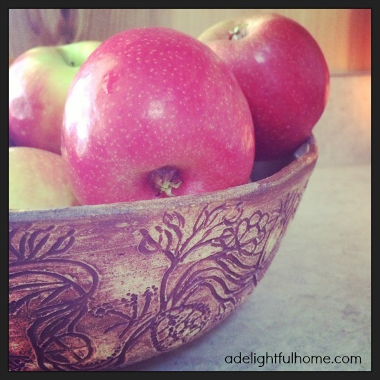 apples in carved bowl