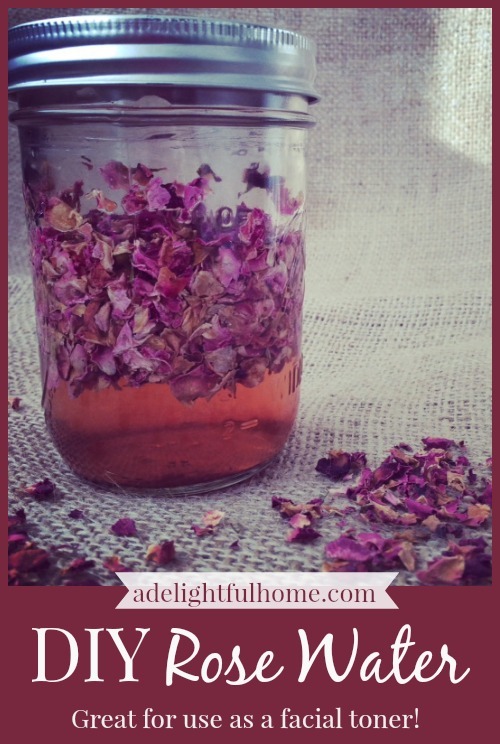 Mason jar filled with rose infused water. Dried rose petals are sprinkled in the foreground. Text overlay says, "