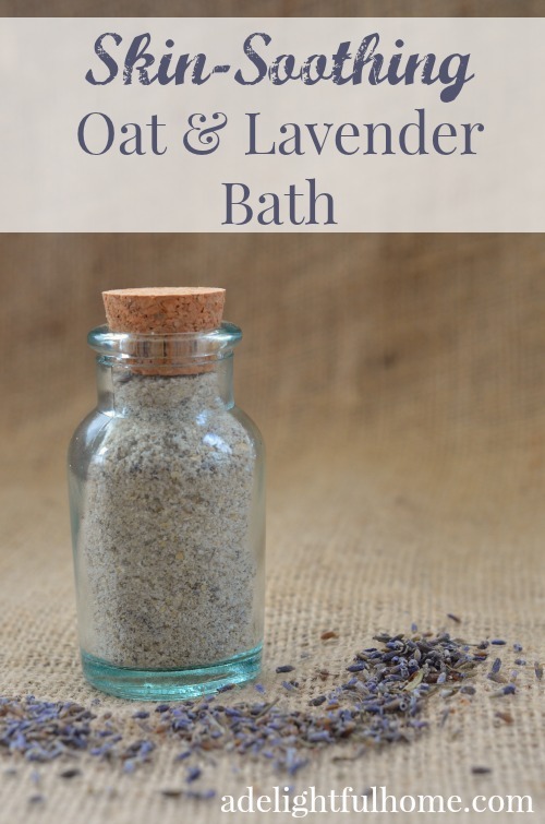 Image of a corked glass bottle filled with a finely ground powder. Dried lavender is scattered beside it for decorative effect. Text overlay says, "Oat & Lavender Bath".