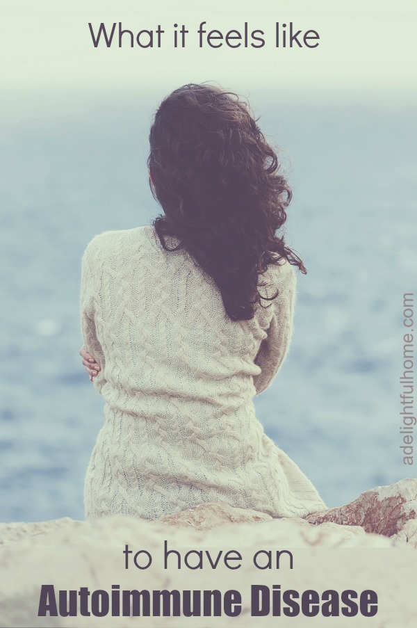 Photo of a woman standing at the water's shore. Her back is to the camera, and the weather is dark and stormy. Text overlay says, "What it Feels Like to Have an Auto-Immune Disease".