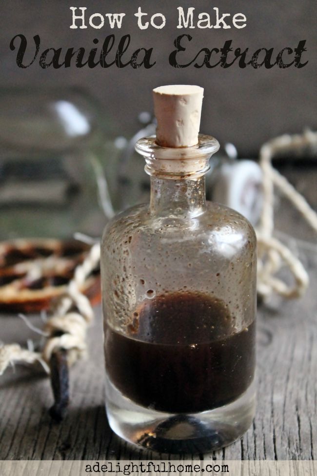 A Close up image of a corked glass bottle half filled with vanilla ext