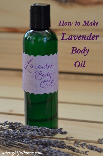 Image of a green bottle with a handwritten purple label that says, "Lavender Body Oil". Text overlay says, "How to Make Lavender Body Oil".