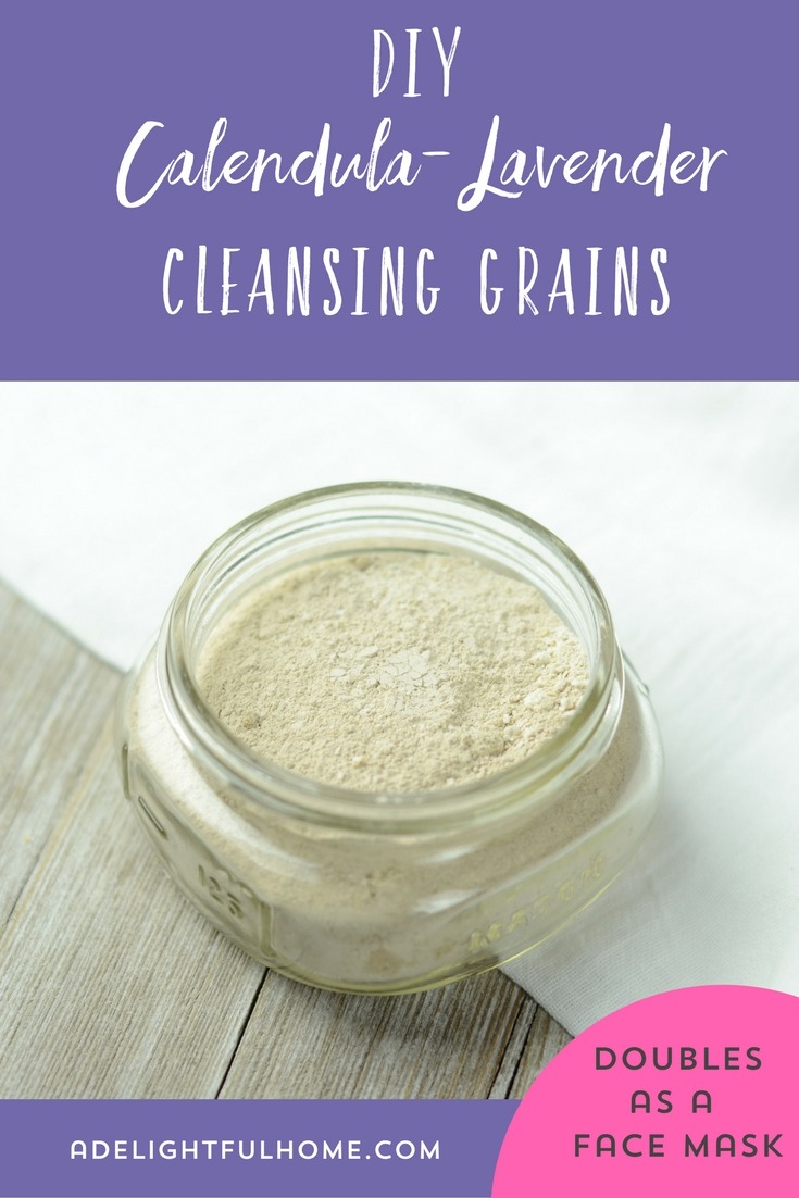 Image of a shallow wide mouth mason jar filled with finely ground powder. Text overlay says, "DIY Calendula-Lavender Cleansing Grains".