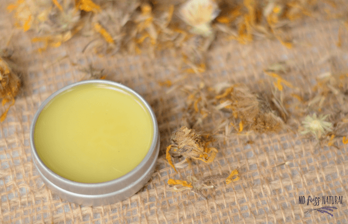 metal tin with homemade arnica salve