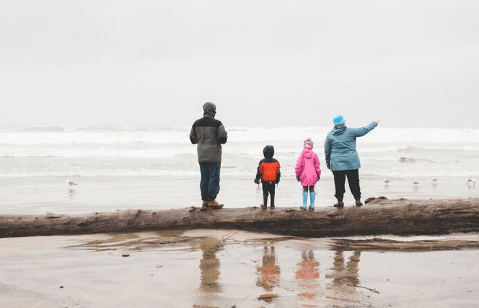 family looking out at wintery ocean