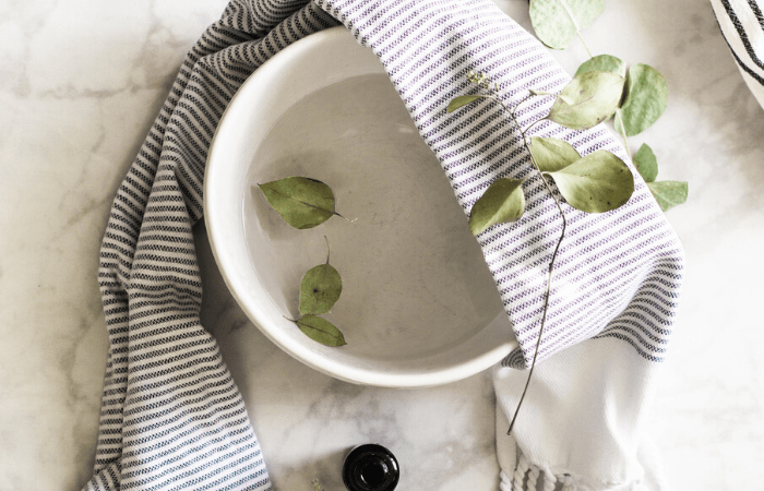 bowl with water and towel for facial steam