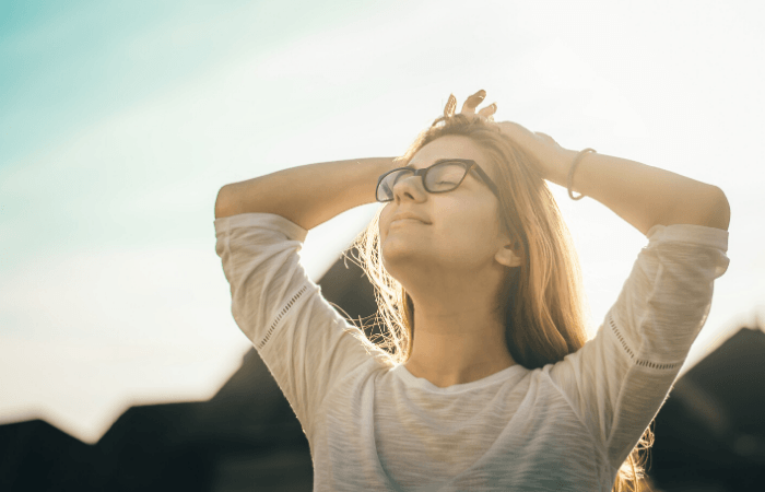 women outside breathing air for stress relief